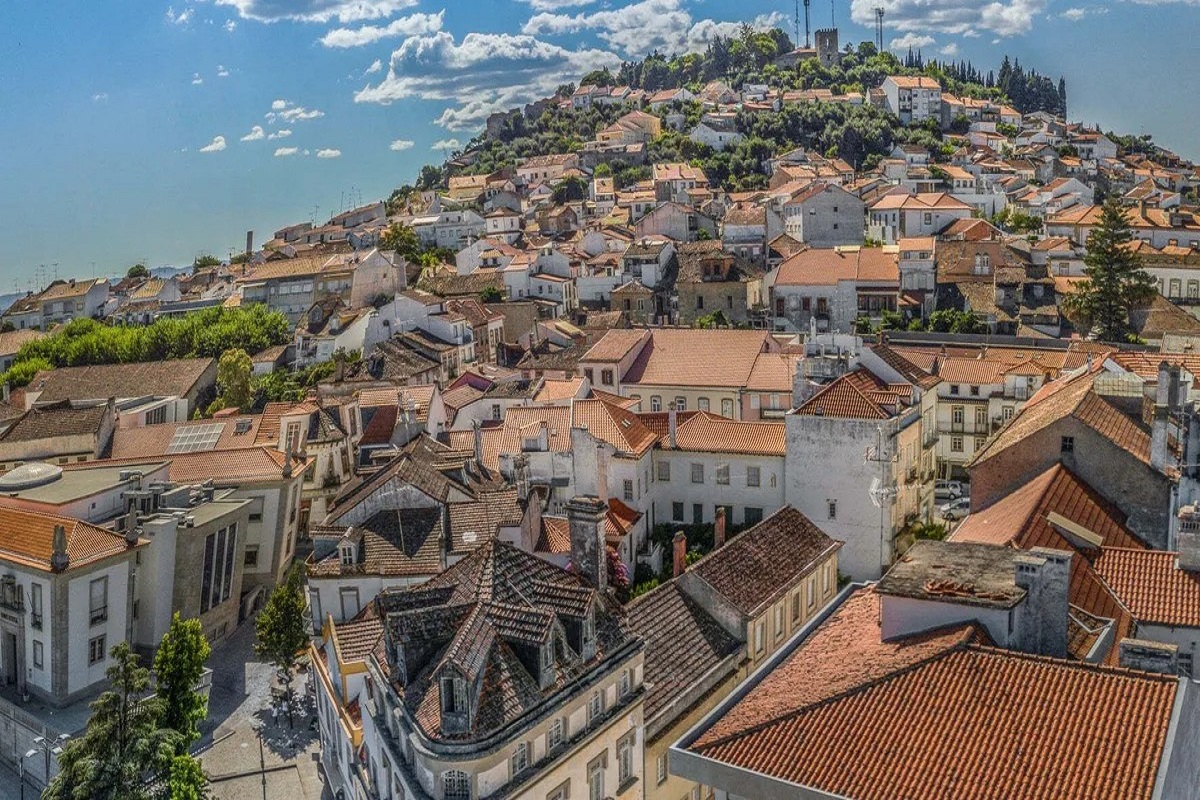 cityscape view of Castelo Branco with castel at hilltop for cannabis travel guide cannatrailz