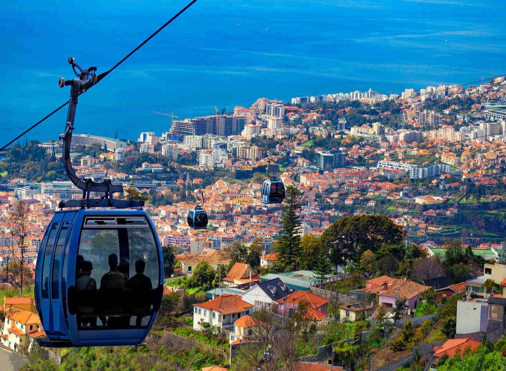 cityscape view of the Madeira cable car abd Funchal city for Funchal cannabis Travel Guide CannaTrailz