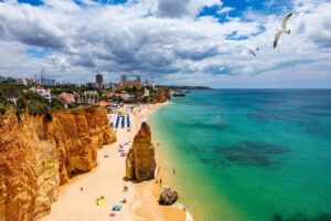 Aerial view of Praia do Vau on summer sunny day for Portimão cannabis travel Guide cannatrailz