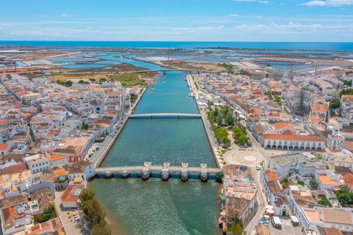 Aerial view of Tavira showing Roman bridge & Gilão river for cannabis travel guide cannatrailz