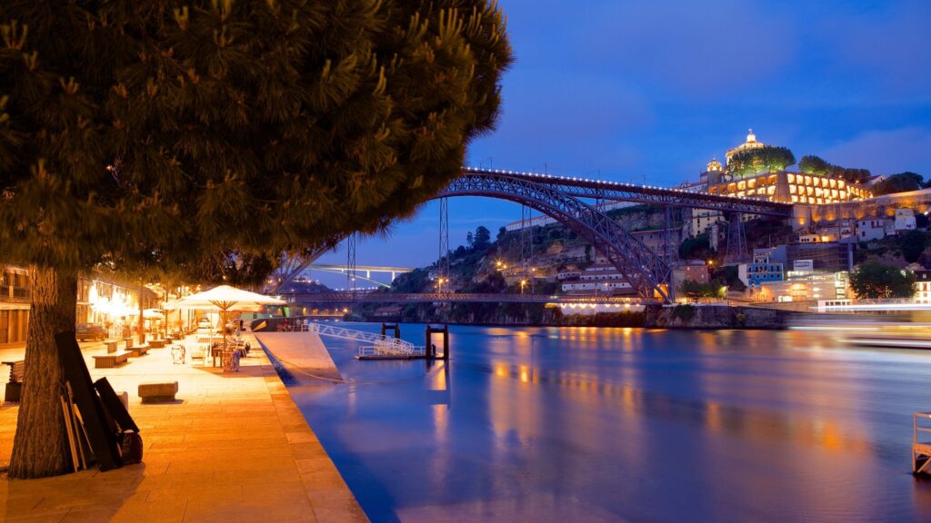 Eveneing view of Douro River & Dom Luis I Bridge in Porto, Portugal.