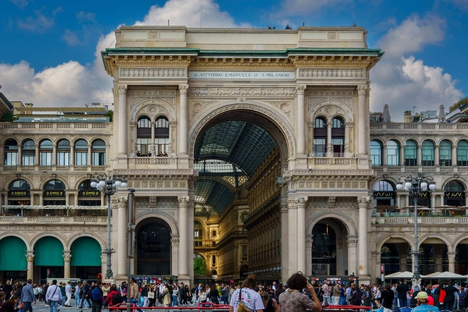 Out view of historic shopping arcade flooded by tourists in Milano, Italy.