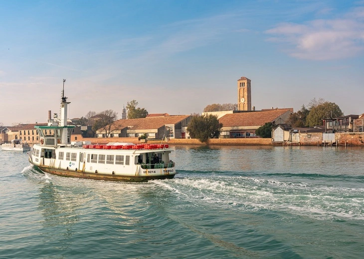 A vaporetto sailing on the canal towards the lighthouse generally creates a tense and visible feeling if you are carrying cannabis in Venice.