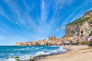 The lungomare and beach on a sunny day for Cannabis in Cefalù Travel Guide.