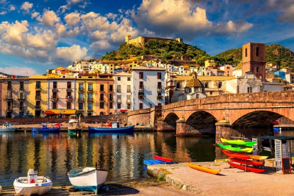 The marina and old bridge with colorful houses in Bosa on Sardinia Island, Italy.