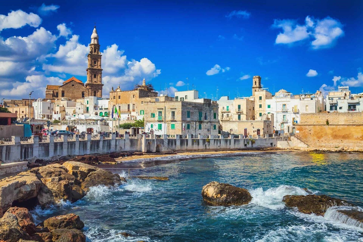 Scenic coast view with historic architecture in Monopoli, Italy.
