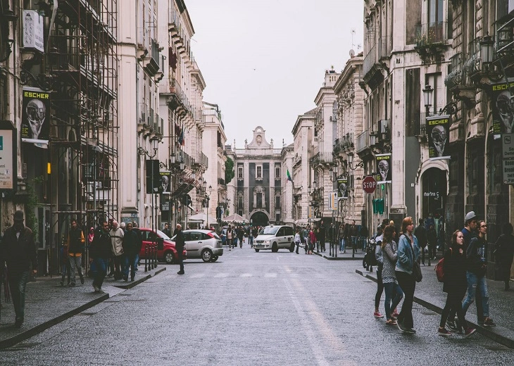 A lively urban street scene that shapes the perception of cannabis in Catania.