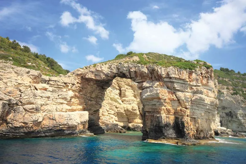 Elevated cliff by the coast with emerald waters