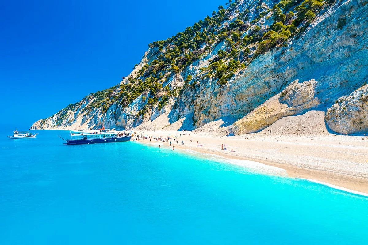The white cliffs & turquoise waters of Egremni beach in Lefkada, Greece.