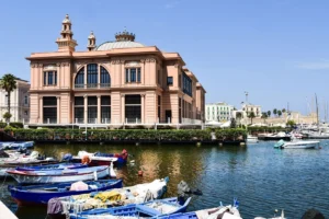 View of the Teatro Margherita and boats in Porto Vecchio of Bari, Puglia, Italy.