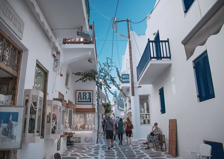 Picturesque street with vibrant architecture in Chora often shapes how cannabis in Mykonos is perceived.