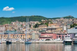 The historic Porto Antico under clear blue skies on a summer day in Genoa, Liguria, Italy.