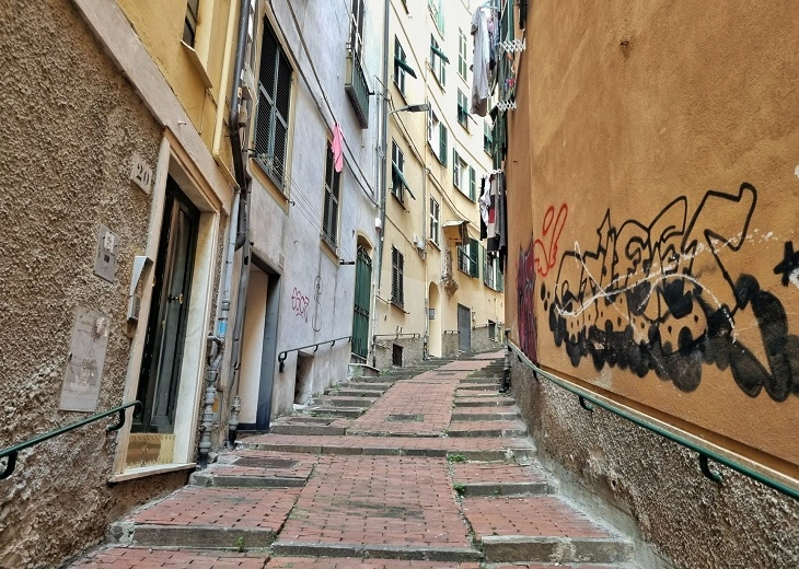 Narrow medieval caruggies create intimate spaces for experiencing cannabis in Genoa's old town.